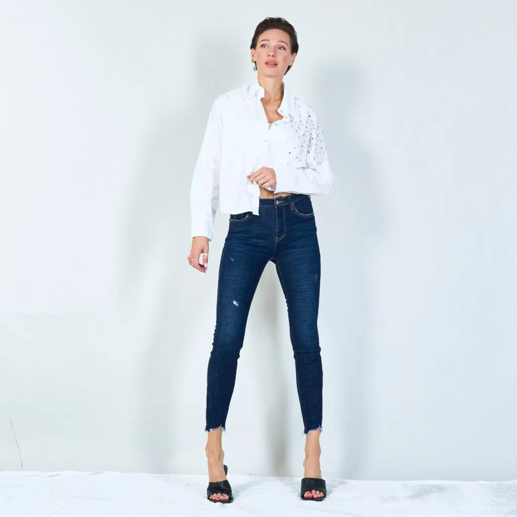 Distressed skinny jeans with raw hem wholesale